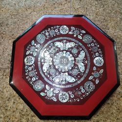 Chinese red lacquer octagonal box with mother-of-pearl inlay.