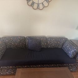 Vintage Black Couch With Floral Print
