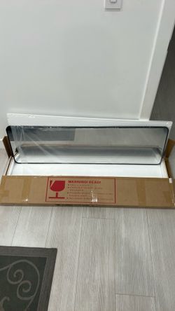 Brand new mirror in box - has hanger for door