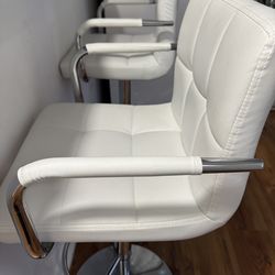 Pair of white adjustable bar stools