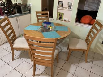 Wooden Kitchen table glass center 4 chairs.