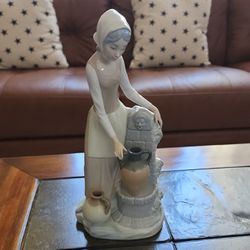 NAO By Lladró Porcelain figurine -Lady At Water Fountain