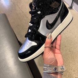 SILVER AND BLACK JORDAN 1s 