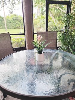 Outdoor Metal Table with Glass atop and 4 Metal Chairs