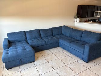Living Spaces Sectional (storage and pull out bed)