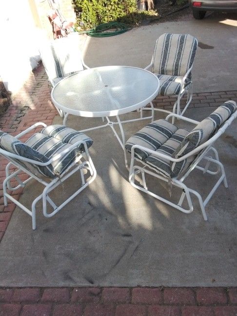 Metal Glass Table With 4 Chairs & Cushions Very Comfortable.