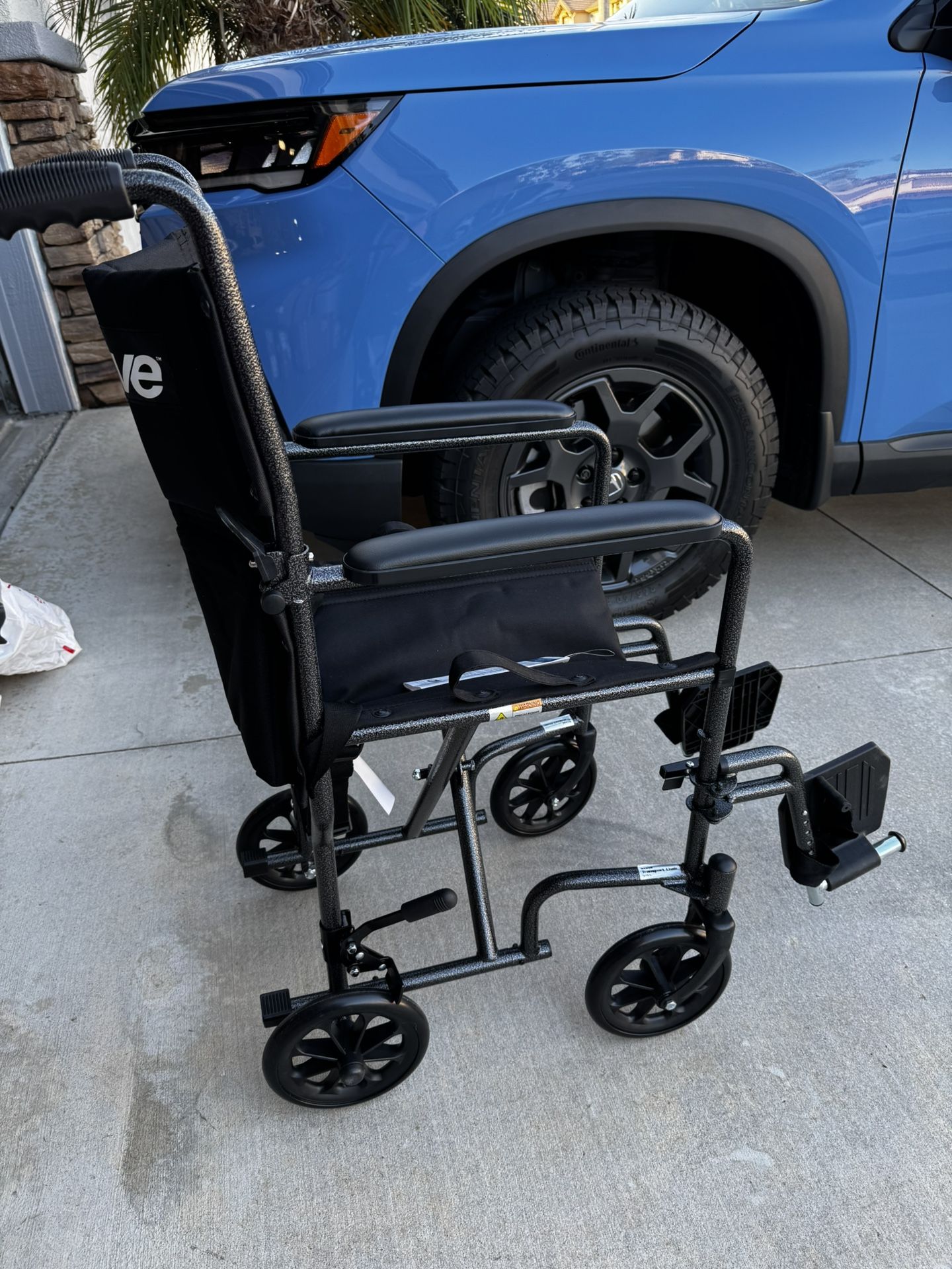Transfer chair Wheelchair With Footrest- Aluminum Slim Model. Brand new!