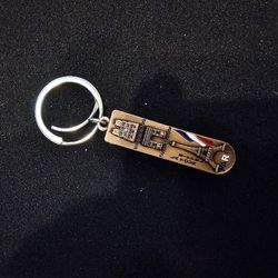 A keychain Eiffel Tower with a special nail clipper