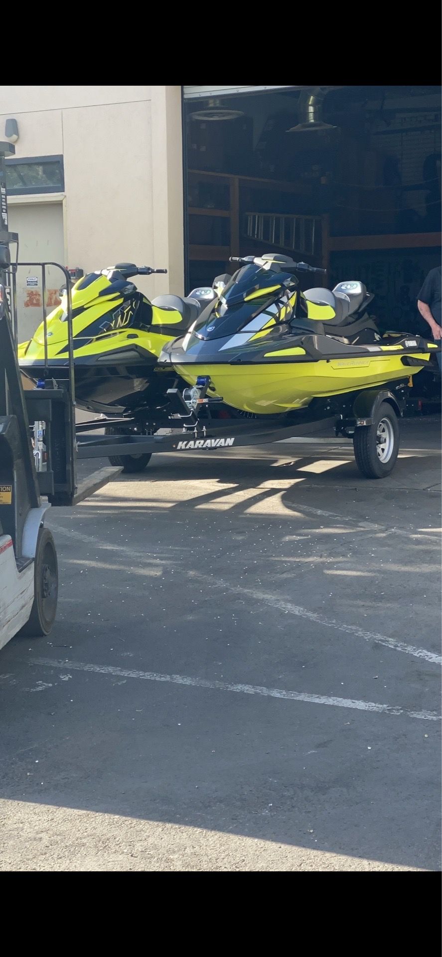 One 3 seater jet ski with a double trailer