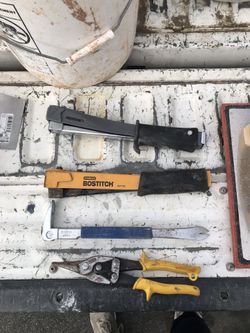 Couple staplers for construction with 4,000 staples . Small pry bar, and some scissors to cut metal