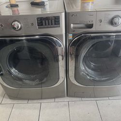 LG DIRECT DRIVE GREY FRONT LOAD JUMBO STEAM WASHER AND GAS DRYER
