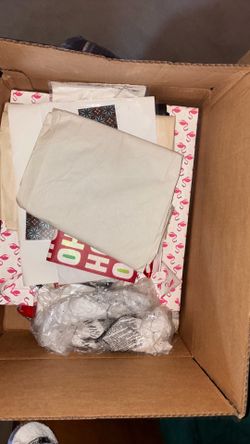 Box of Christmas bags and paper