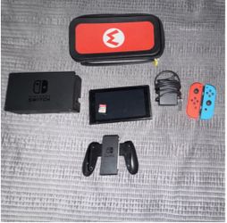 BLUE AND RED NINTDENDO SWITCH PLUS ACCESORIES