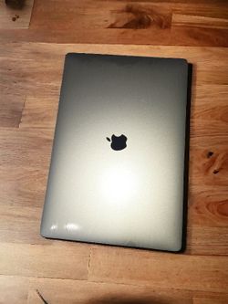 **Apple MacBook Pro 15-inch (2018) w/ Touch Bar - Excellent Condition, Minor Cosmetic Flaw**

