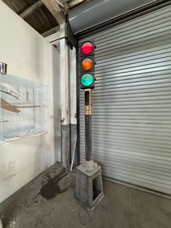 Vintage Industrial Three-Light Traffic Signal on Stand