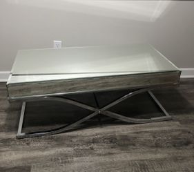 Coffee table with glass top.