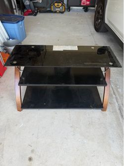 Three tier glass entertainment center