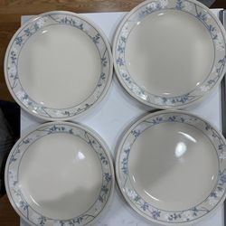 A Set Of 4 Corelle Sandstone Colored Dinner Plates