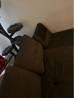 Four seater Couch with storage cabinets and a coffee table