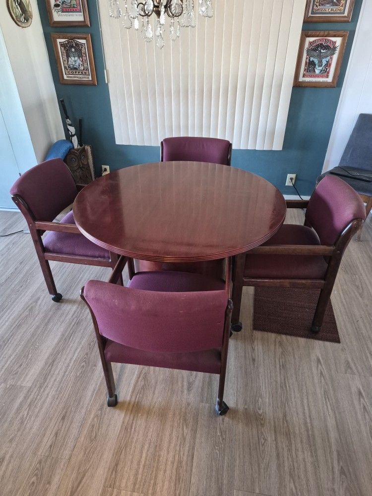 Round Table And 4 Wheeled Chairs