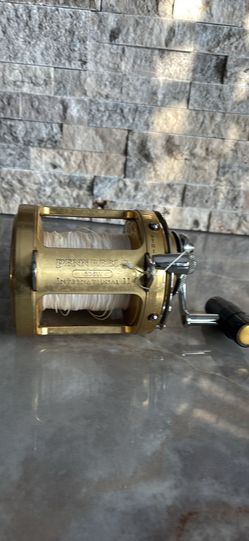 Gold PENN INTERNATIONAL 50SW TWO SPEED BIG GAME Fishing Reel with 130 lb Spectra.