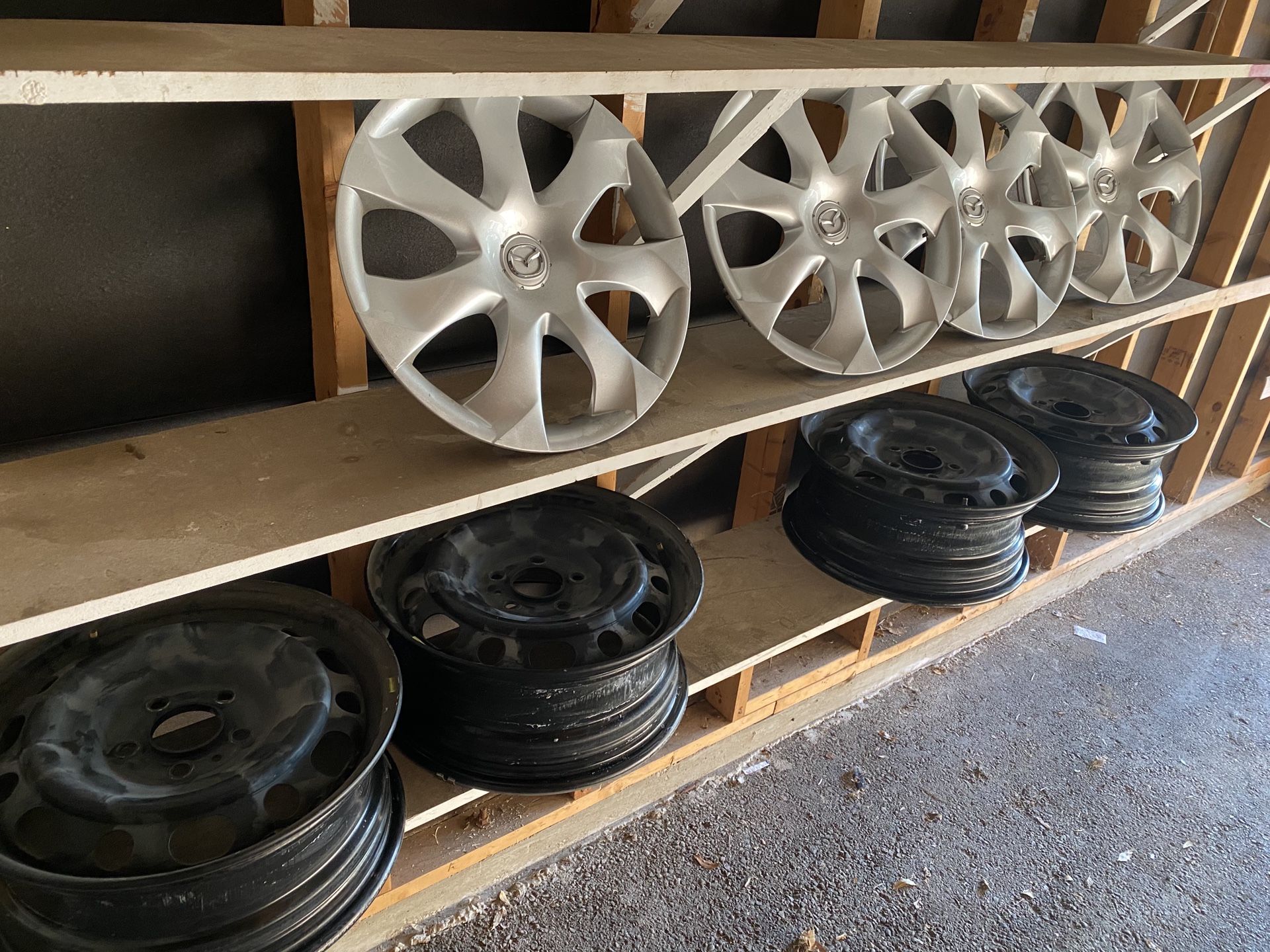 16” black wheels and Mazda factory hub caps