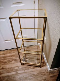 2 stand alone gold and glass shelves