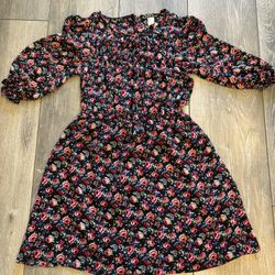 Small black knee-length dress with beautiful red flowers all over