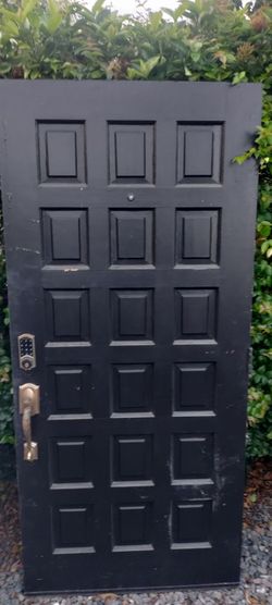 Exterior solid wood heavy door approximately 36x79
