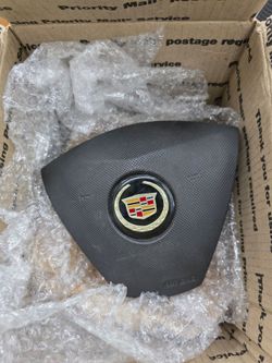 2003 to 2007 Cadillac CTS center steering wheel horn.