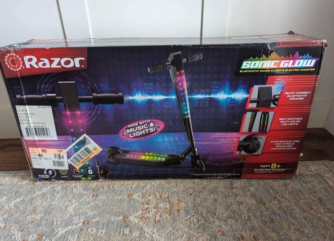 NEW In box/ Unopened Electric Razor Scooter With Built-in Bluetooth