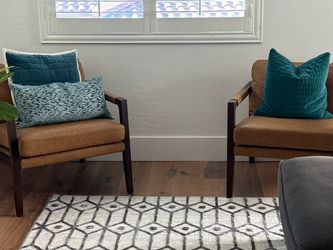 2 leather chairs with wood arms, legs