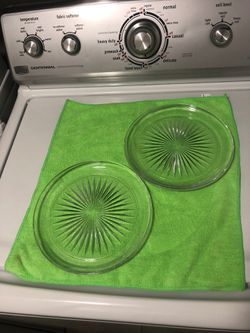 Two glass plates for candles or under pots