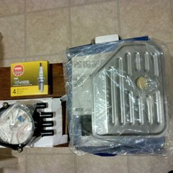 New Auto Parts: Spark Plugs, Trans. Filter Kit, Cap & Rotor