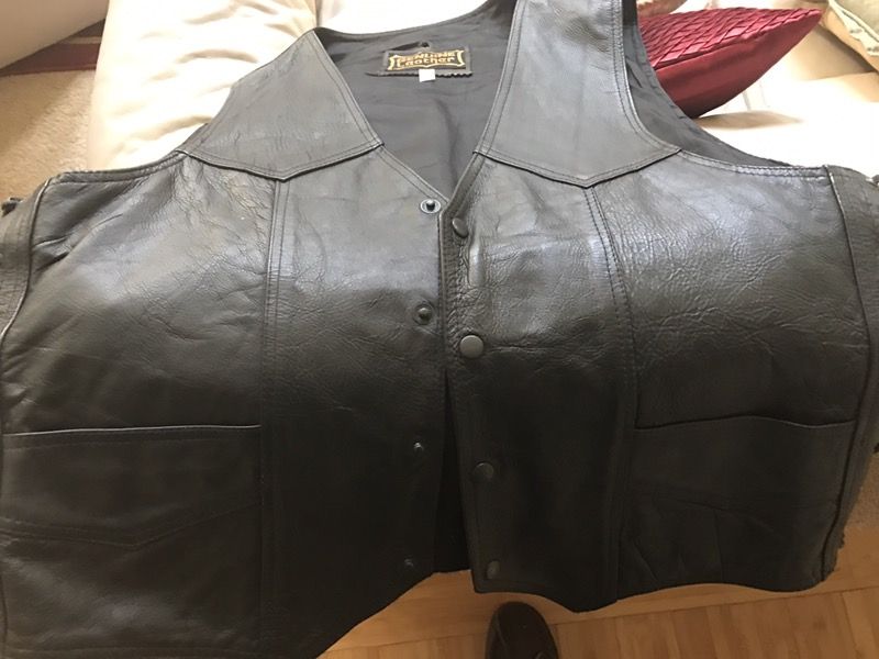 Leather vest XL with Harley emblem lower back.