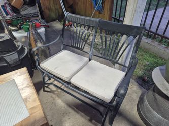 Nice Used cast iron aluminum two Seater glider. With bottom cushions.