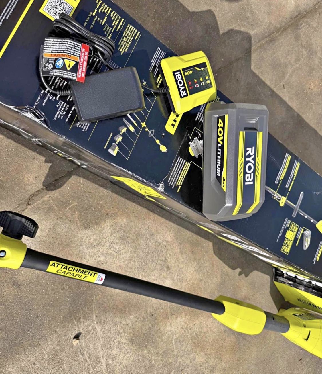 RYOBI 40V 15 in. Expand It Cordless Battery Attachment Capable String Trimmer with 4.0 Ah Battery an