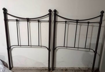 twin size vintage wrought-iron head boards. Two available.