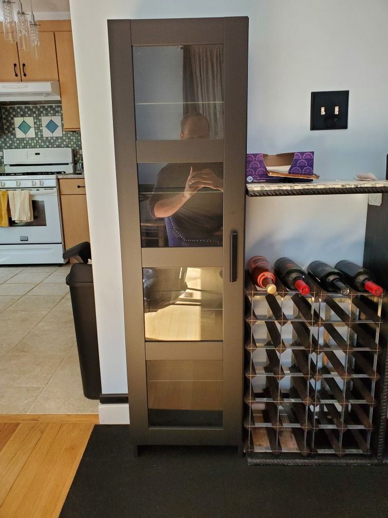 Two slender black cabinets. $50 each