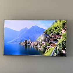 70 inch LG Smart TV and table. 