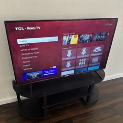 TCL 50inch 4K UHD Roku Tv with table