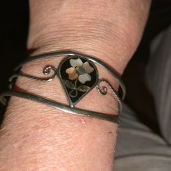 Silver clamp bracelet with onyx and Mother Of Pearl stones