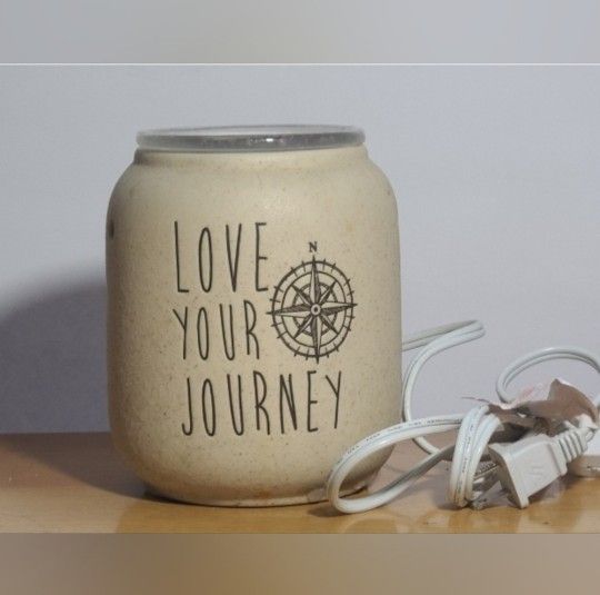 Scentsy Love your Journey wax warmer
has a little wax on it