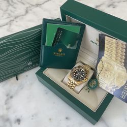 GMT master ll gold  with black dial