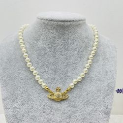 Brand new pearl necklace with golden yellow pendant