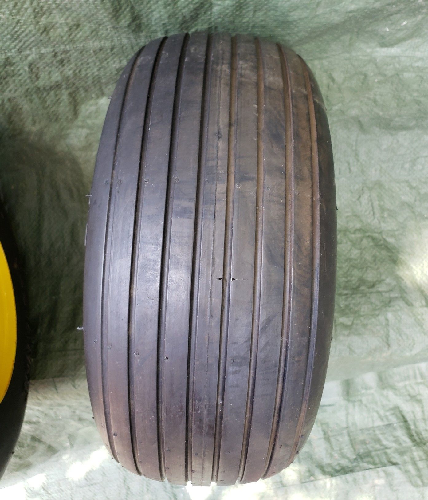 Pair of 13x6 50 6 reliance flat free ribbed lawnmower tires on jd