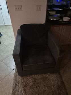 Dark blue chair and mating ottoman