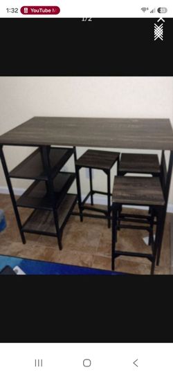 Great table/desk with 3 stools and 3 shelves on the side