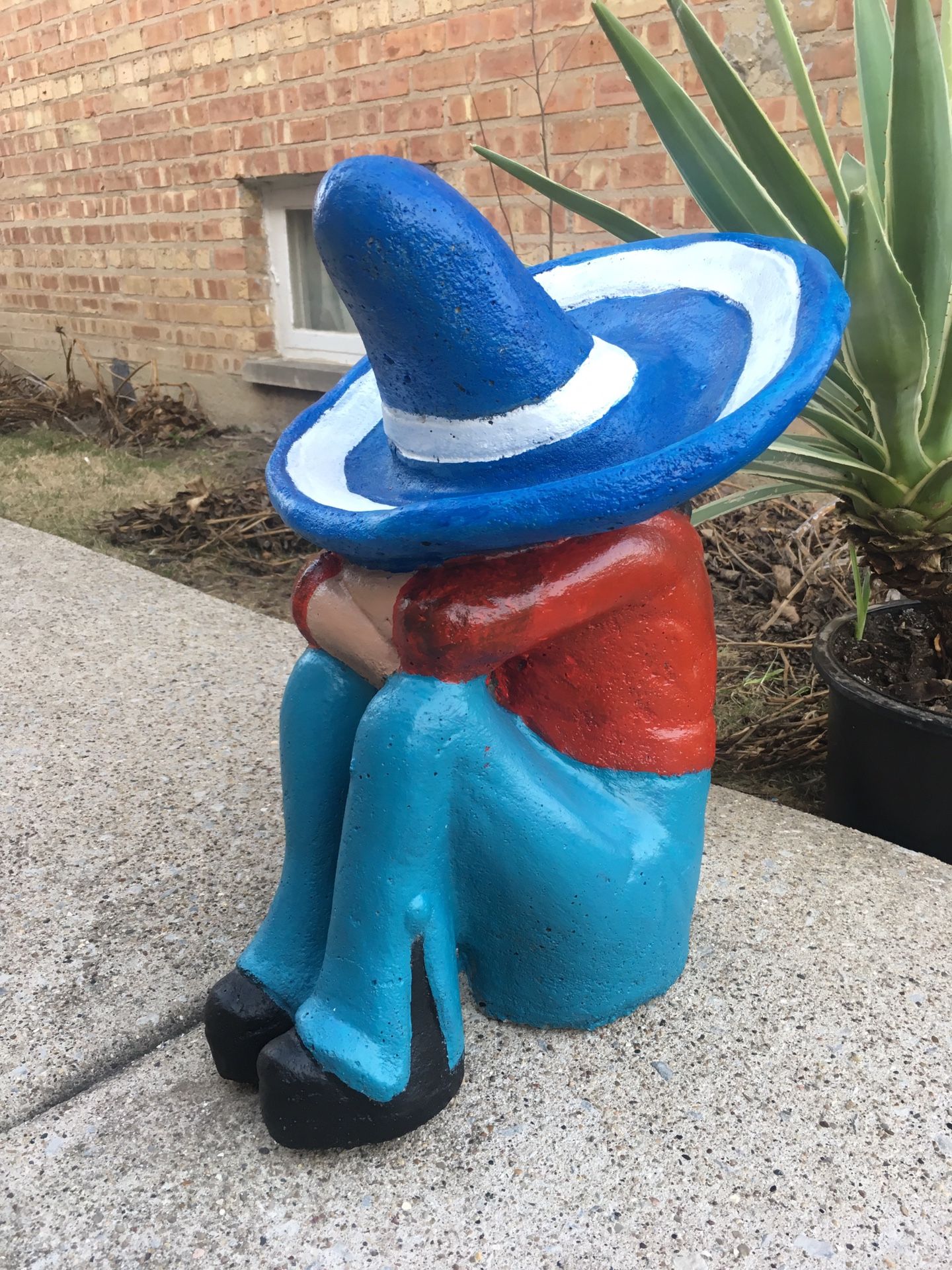 Outdoor garden sleeping mexican concrete statue