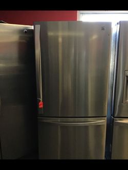 Used kenmore stainless steel bottom freezer fridge. 1 year warranty